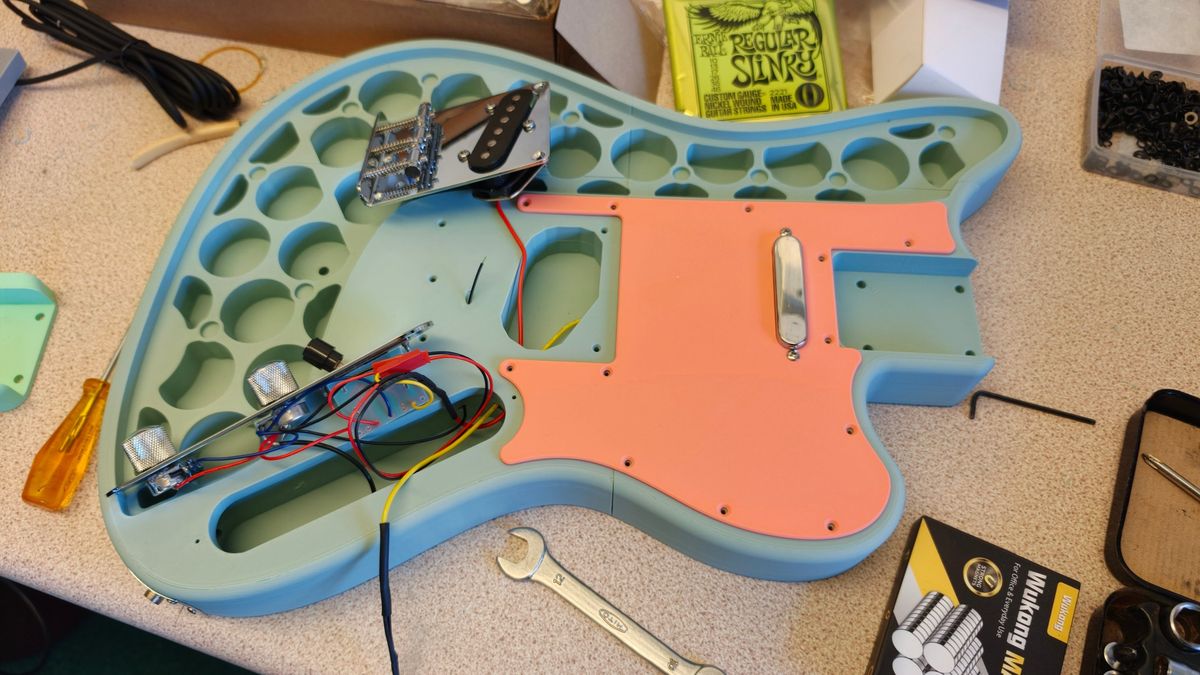 Wiring the controls before the pickguard goes on.